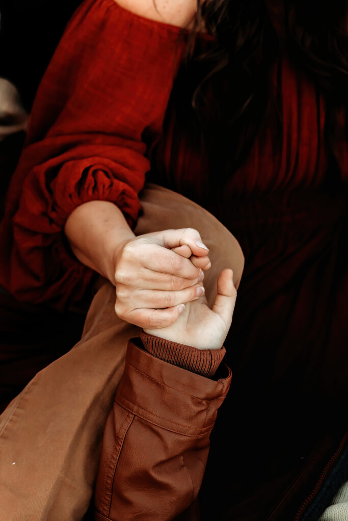 mother holding son's hand