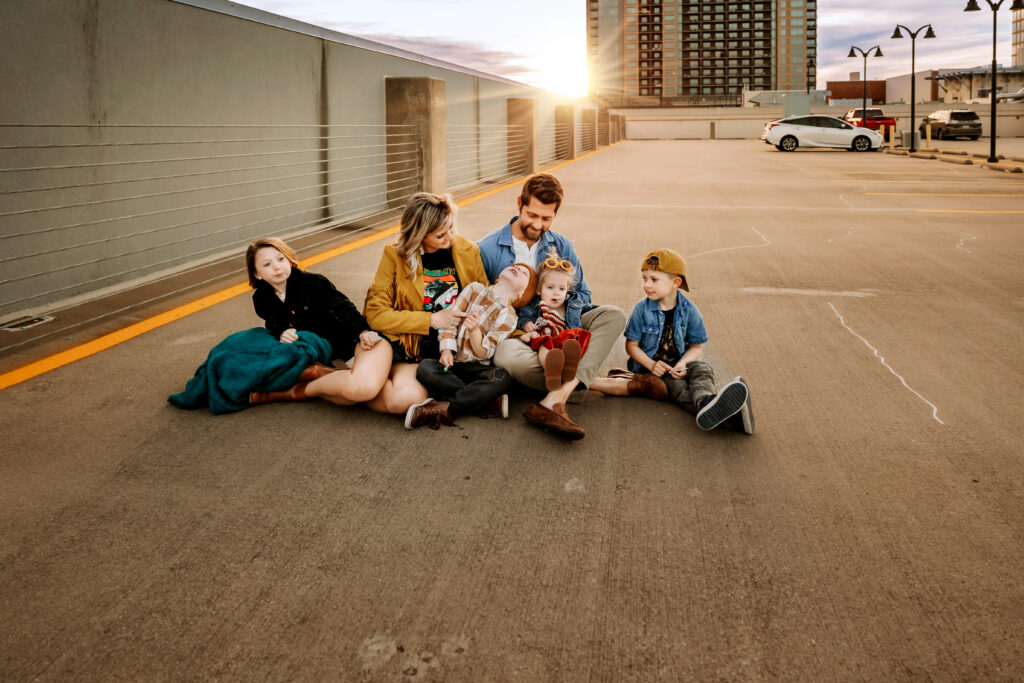 family hanging out on a rooftop