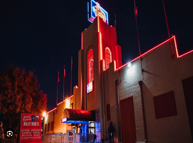 night shot of the entrance of billy bob's in fort worth texas
