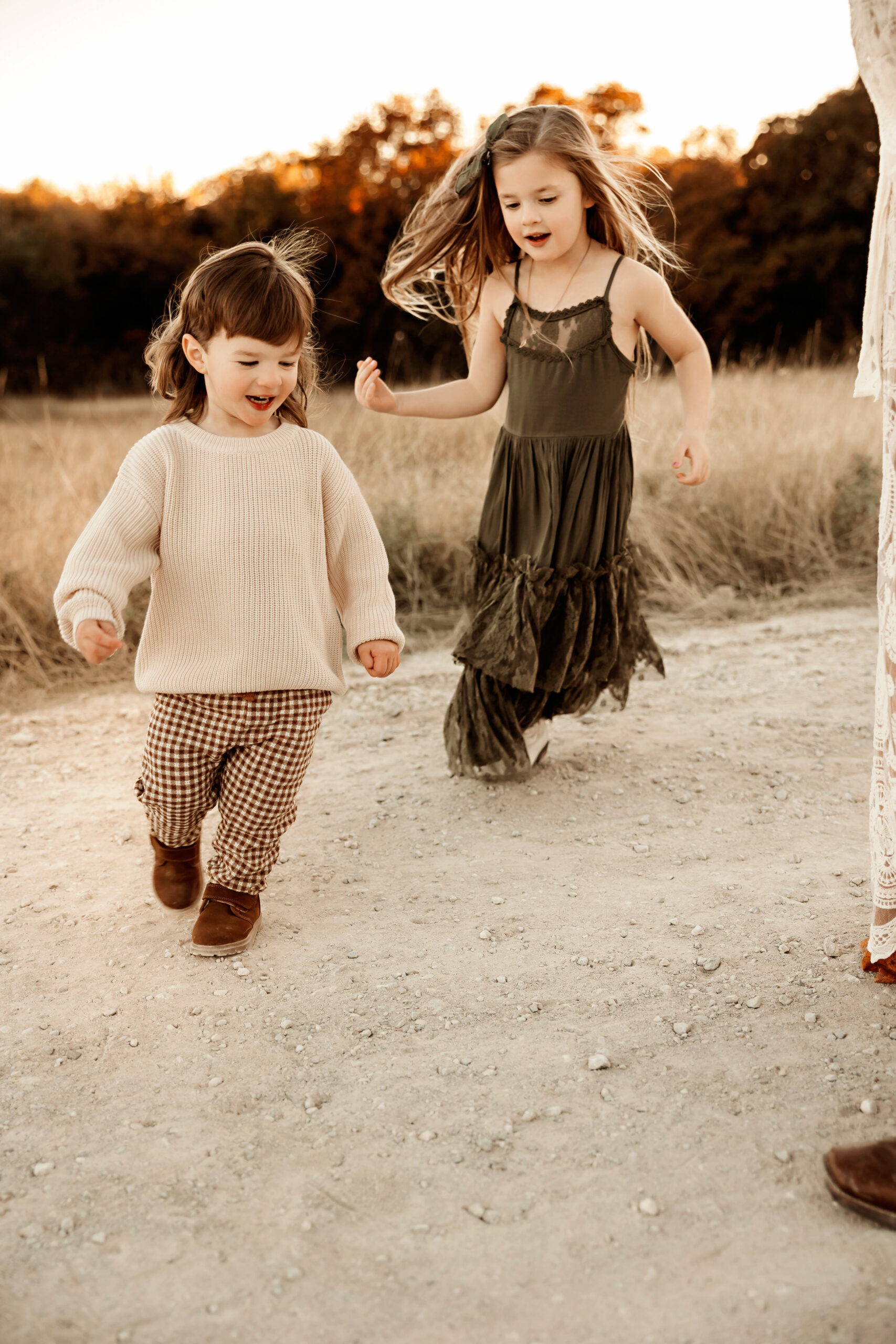 toddlers running during an evening photoshoot