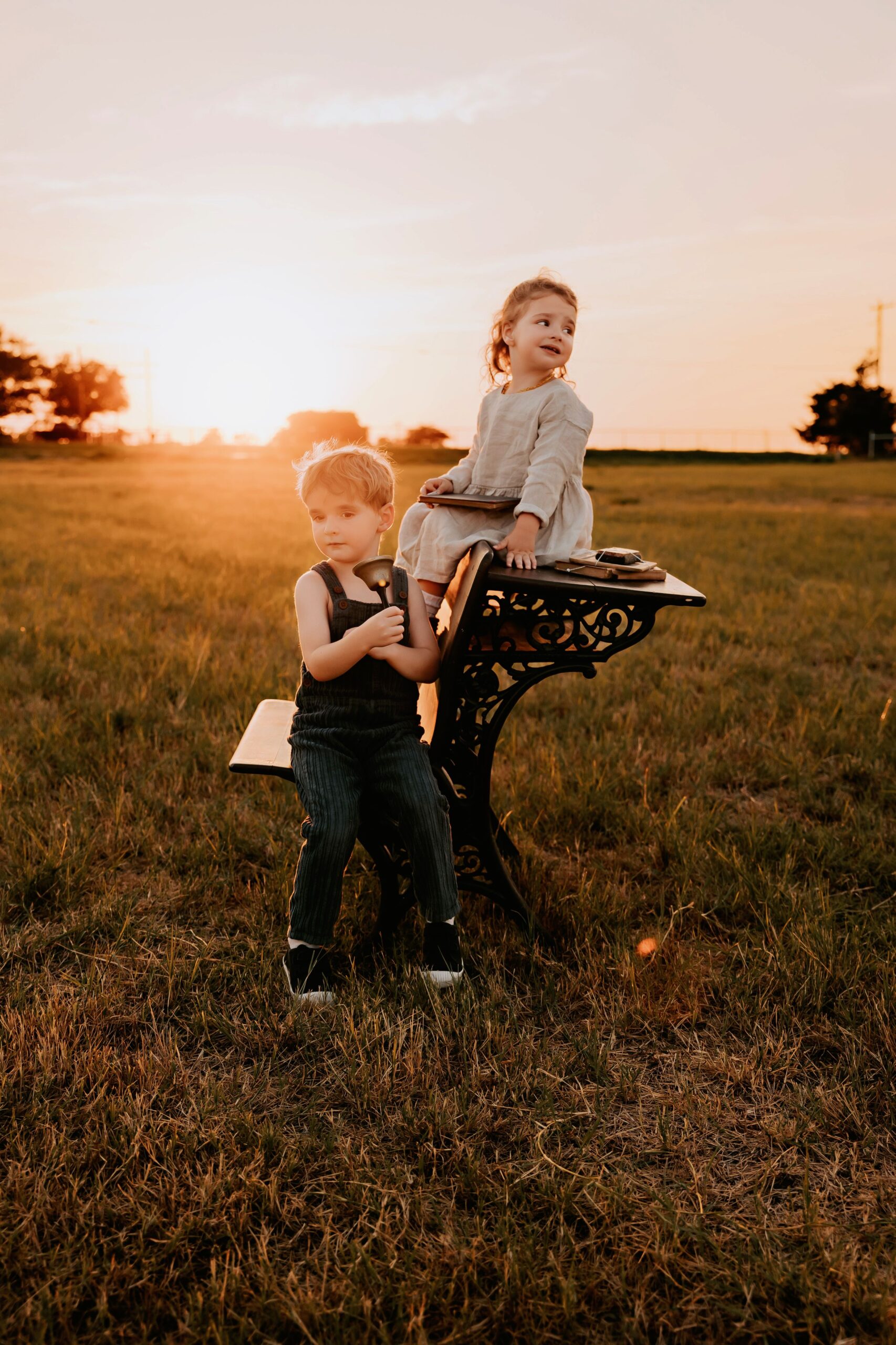 kids in the sunset on a vintage school desk
