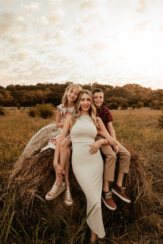 Family cuddling together at sunset during Fall Mini Session in Fort Worth TX